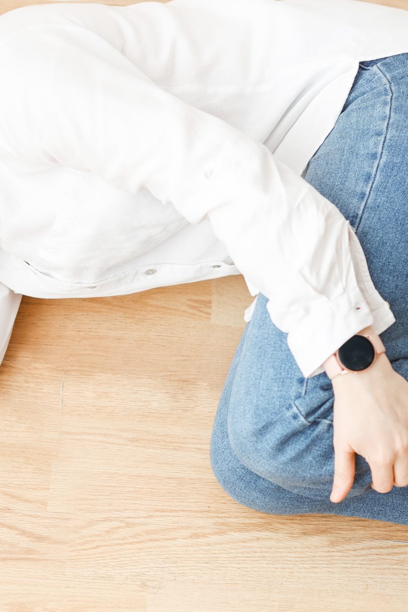 a-girl-with-a-phone-is-lying-on-the-floor-2022-11-15-17-44-30-utc